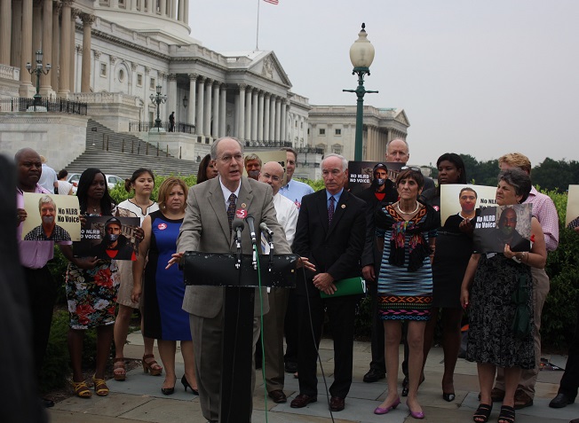 Congressman Foster stands with workers