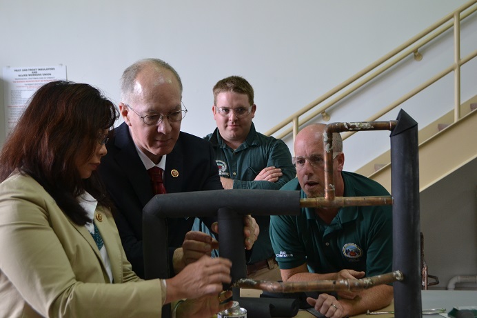 Congressman Foster works with Congresswoman Tammy Duckworth